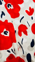 Abito corto con fiori e pois