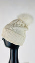 Cappello a trecce con pompon