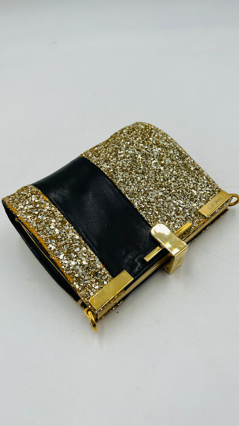 Clutch glitterata dorata con inserto in pelle