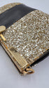 Clutch glitterata dorata con inserto in pelle