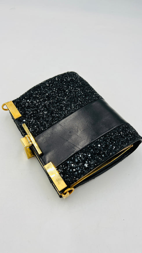 Clutch glitterata con inserto in pelle