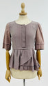 Blusa in seta a balze