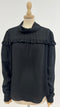 Blusa con balza