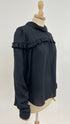Blusa con balza
