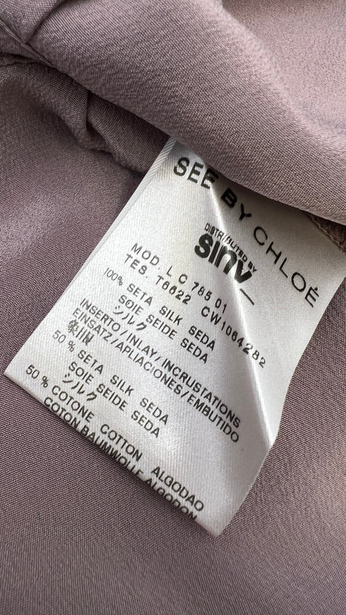 Blusa in seta a balze