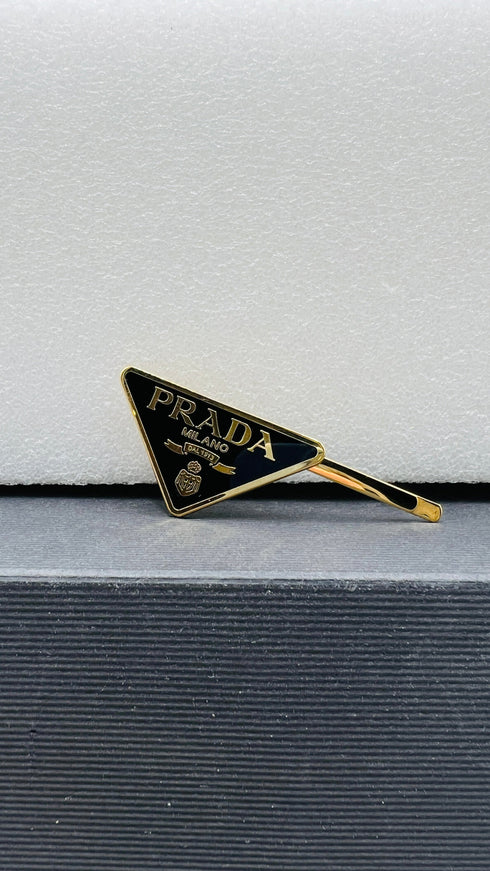 Fermacapelli triangolo singolo