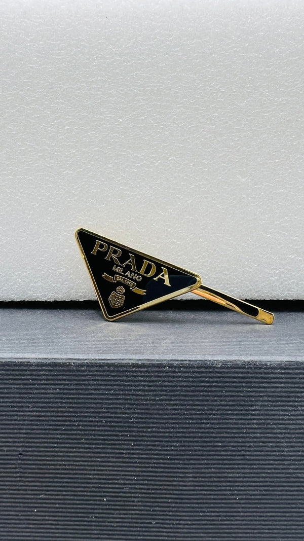 Fermacapelli triangolo singolo