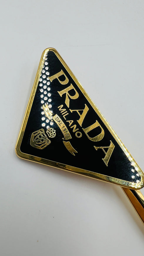 Fermacapelli triangolo singolo