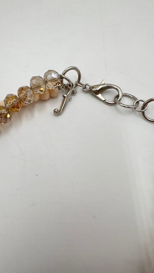 Collana con piume e perline