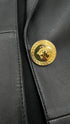 Blazer in pelle con spilla