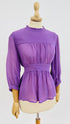 Blusa con fiocco
