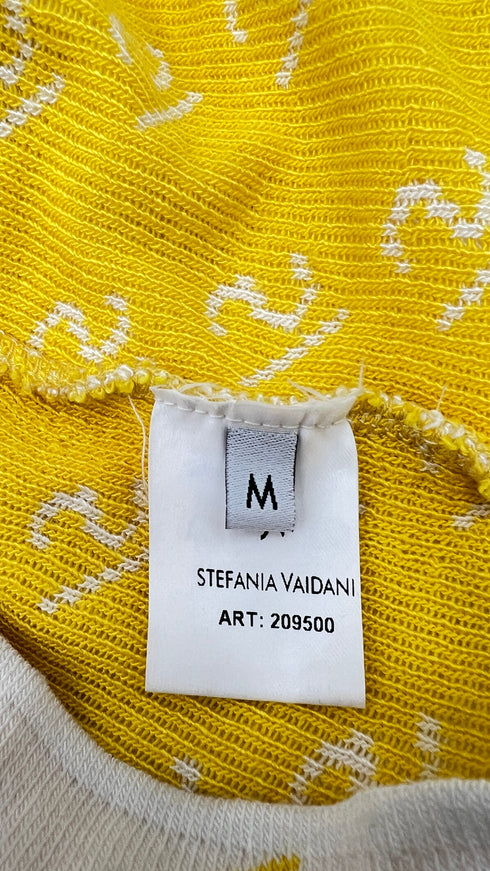 Cardigan corto con cartellino