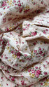 Top floreale con cartellino