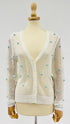 Cardigan a rete con pon-pon