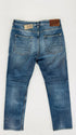 Jeans slim con cartellino